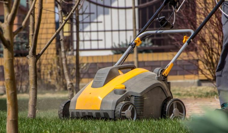 Lawn aerator yellow